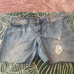 Distressed denim cutoff shorts with long inseam